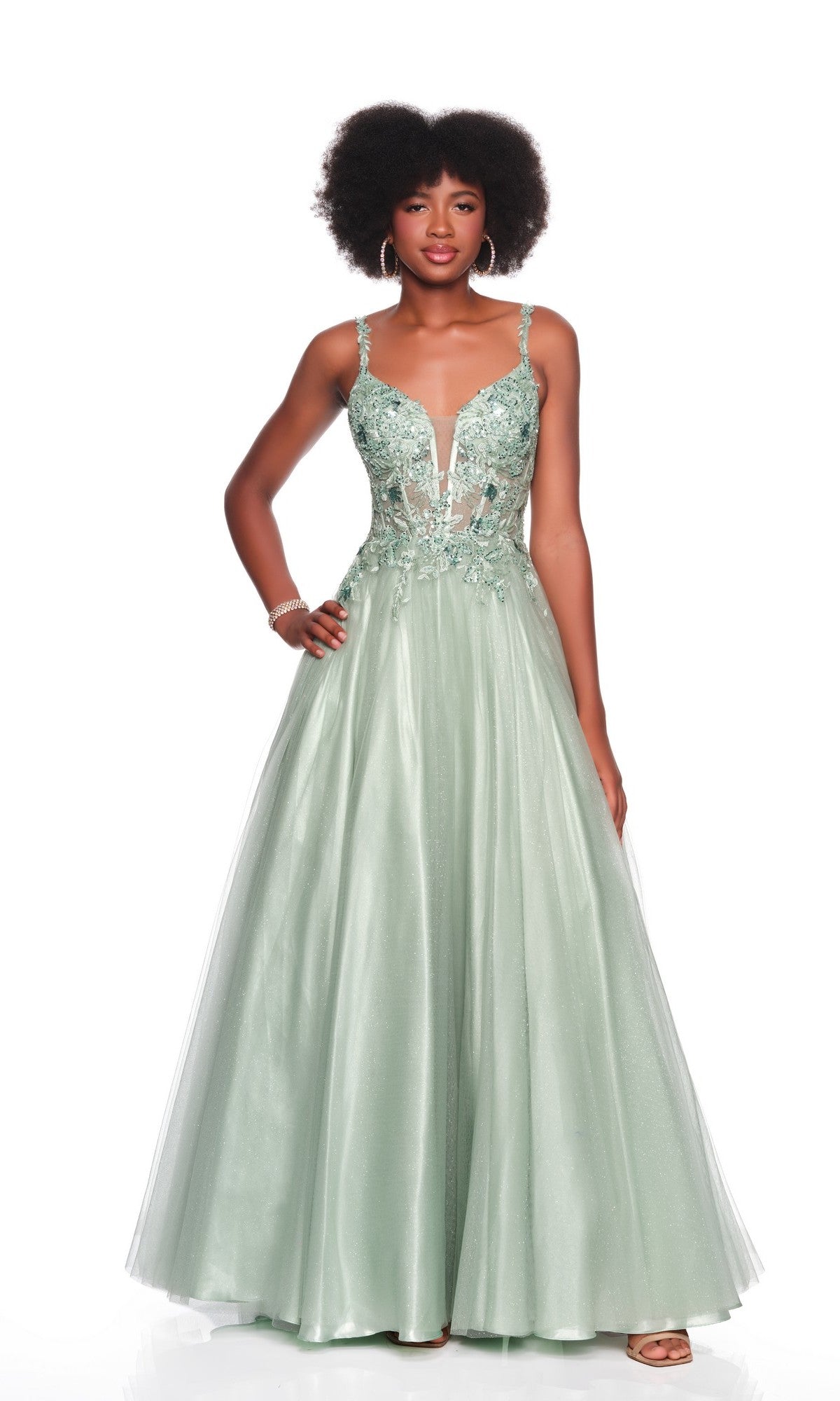 Woman modeling the Long Prom Dress: Dave and Johnny 12882, a light-green gown with lace-embroidered corset bodice, deep V neckline, and sheer tulle A-line skirt with floral details, posed against a white background.